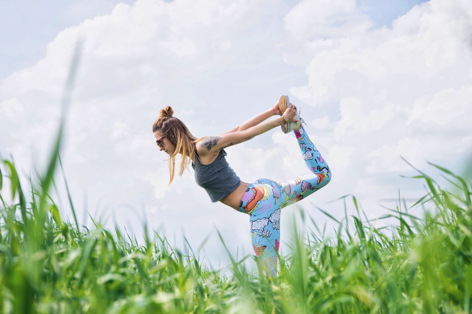 women doing yoga in a field